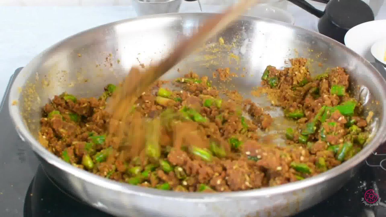 Image of the cooking step-1-11 for Besan Mirchi Ke Tipore - Garm Flour Green Chili Stir-Fry