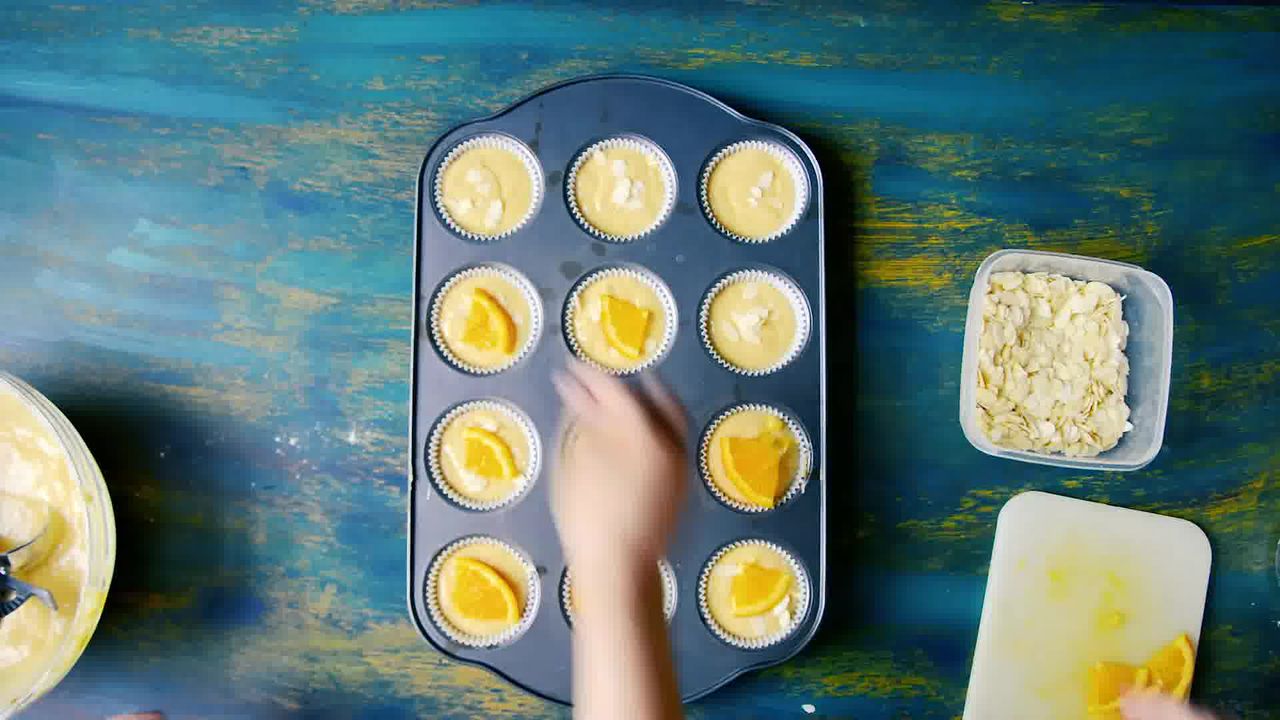 Image of the cooking step-1-8 for Orange Olive Oil Muffins Recipe - Eggless