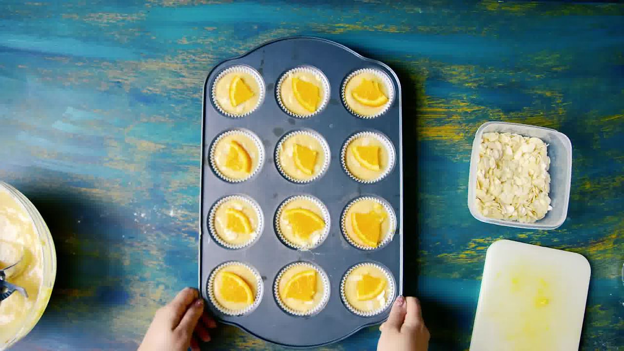 Image of the cooking step-1-9 for Orange Olive Oil Muffins Recipe - Eggless