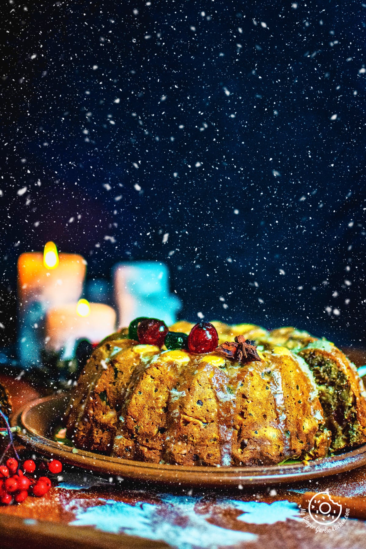 beautiful snow flakes falling on a fruit cake