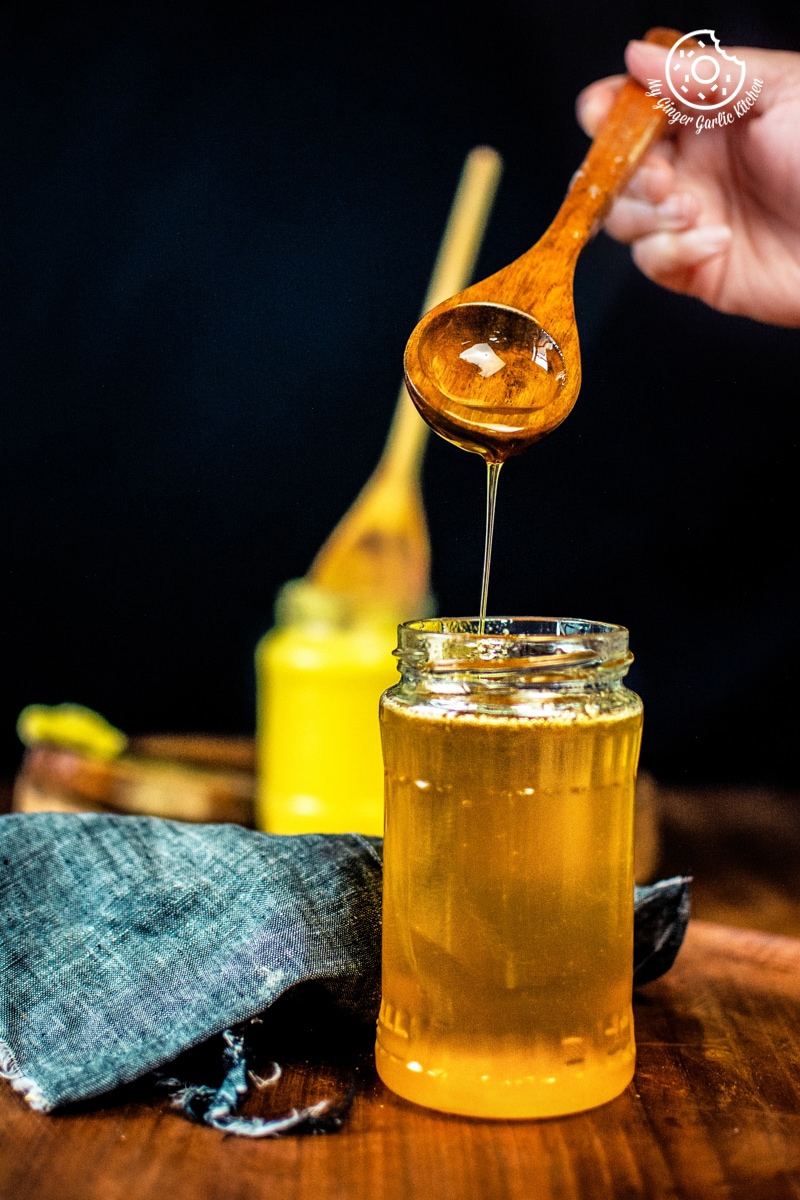 melted golden ghee in a glass jar