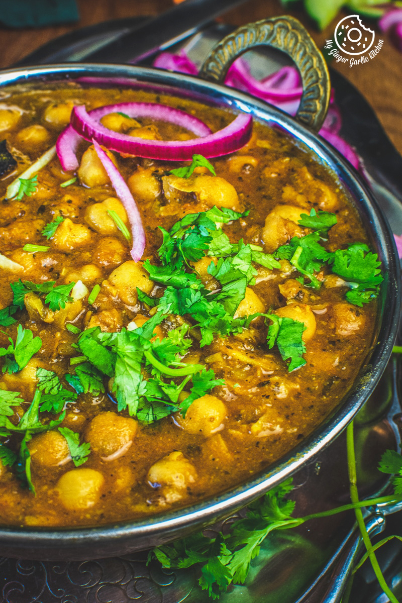 instant pot chole masala served in a copper bowl