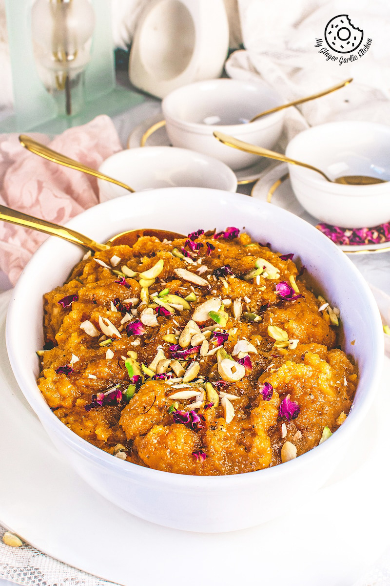 mango halwa topped with nuts and dried rose leaves