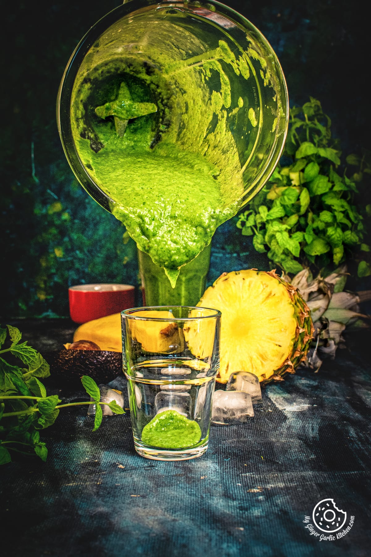 pouring shot of green smoothie