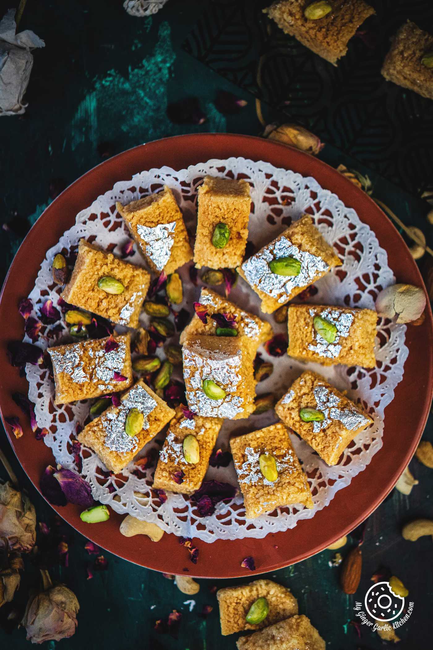 overhead shot of indian milk cake served in a brown plate
