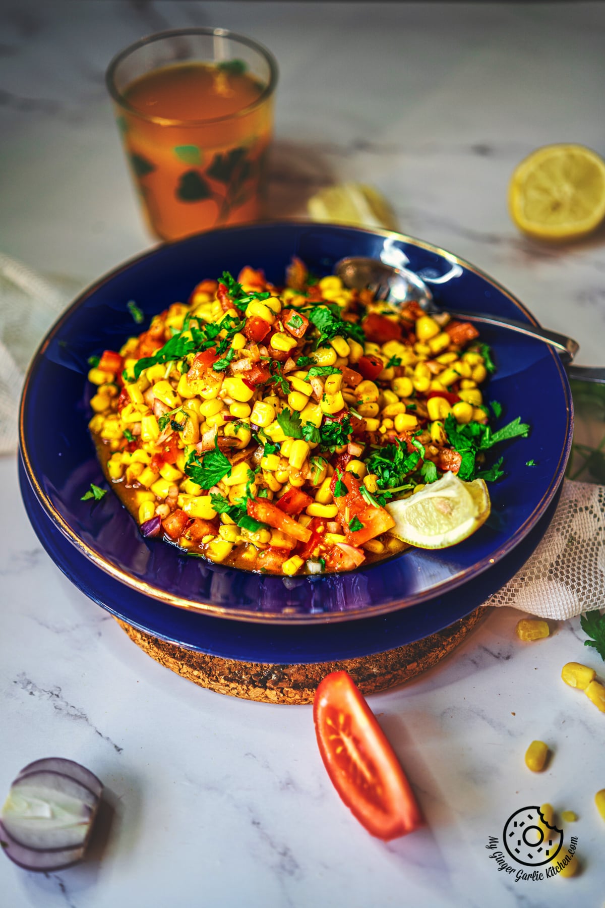 Corn Chaat Recipe. Sweet Corn Chaat served in a blue plate