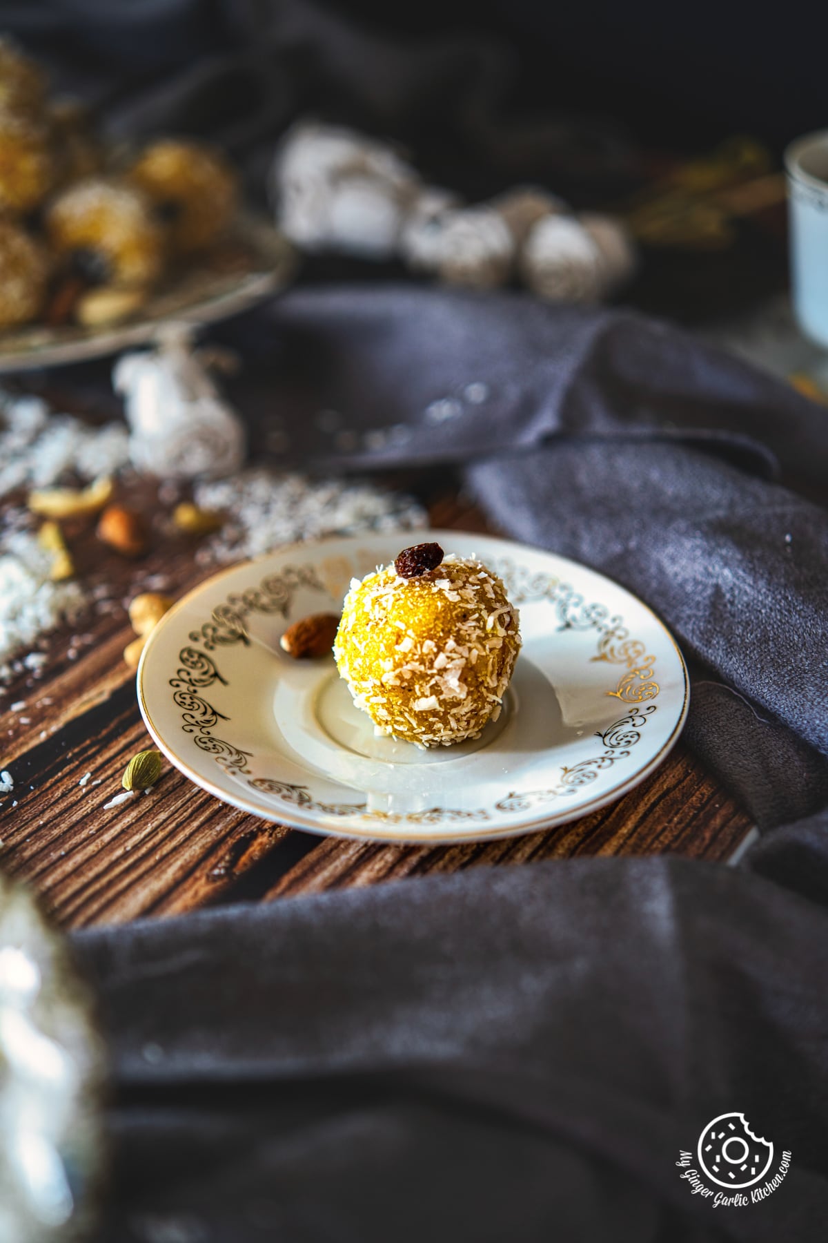 one pineapple ladoo on a white golden plate