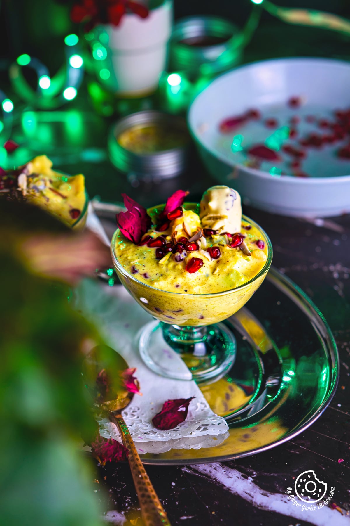 fruit rabri decorated with pomegranate in a transparent dessert glass