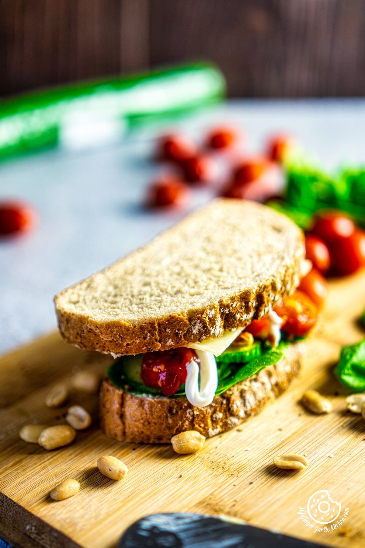 a closeup of 2-minute veggie sandwich on a wooden board