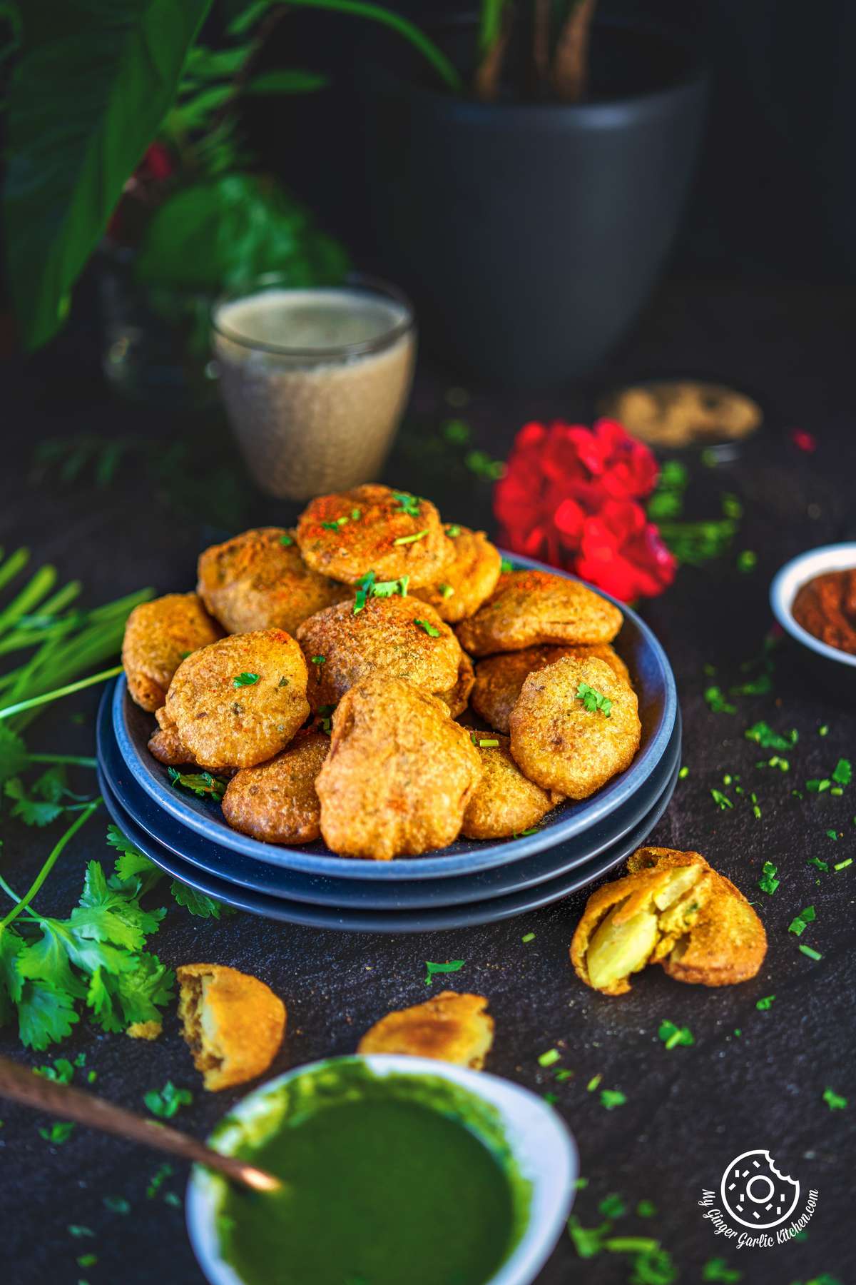 photo of a plate of fried aloo pakora with dipping sauce and a glass of coffee