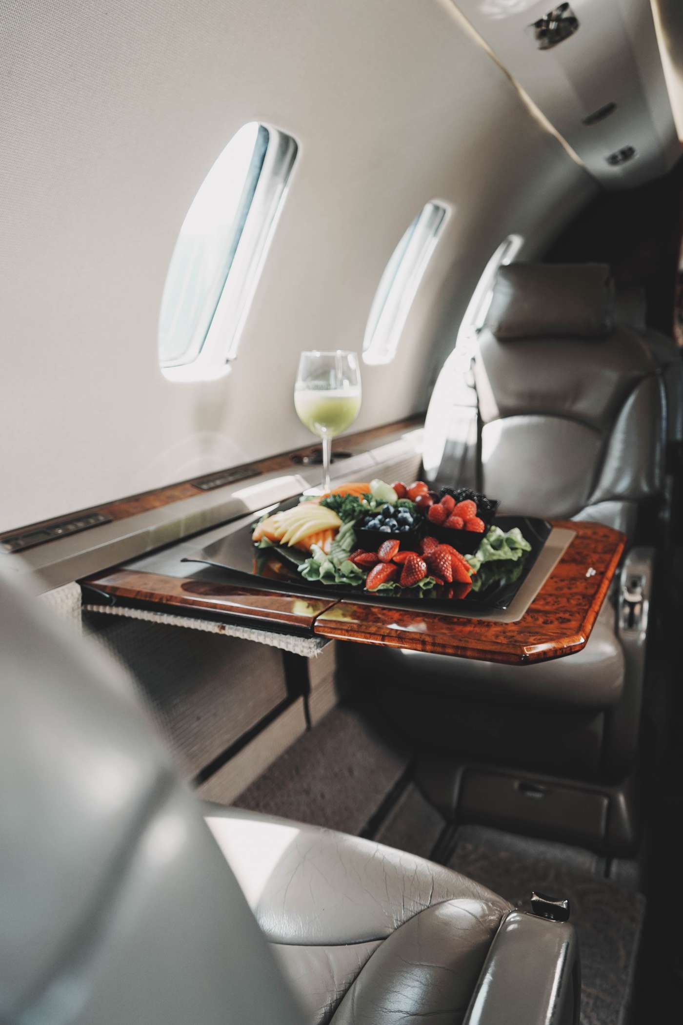 Image of business class air plane with food on the table