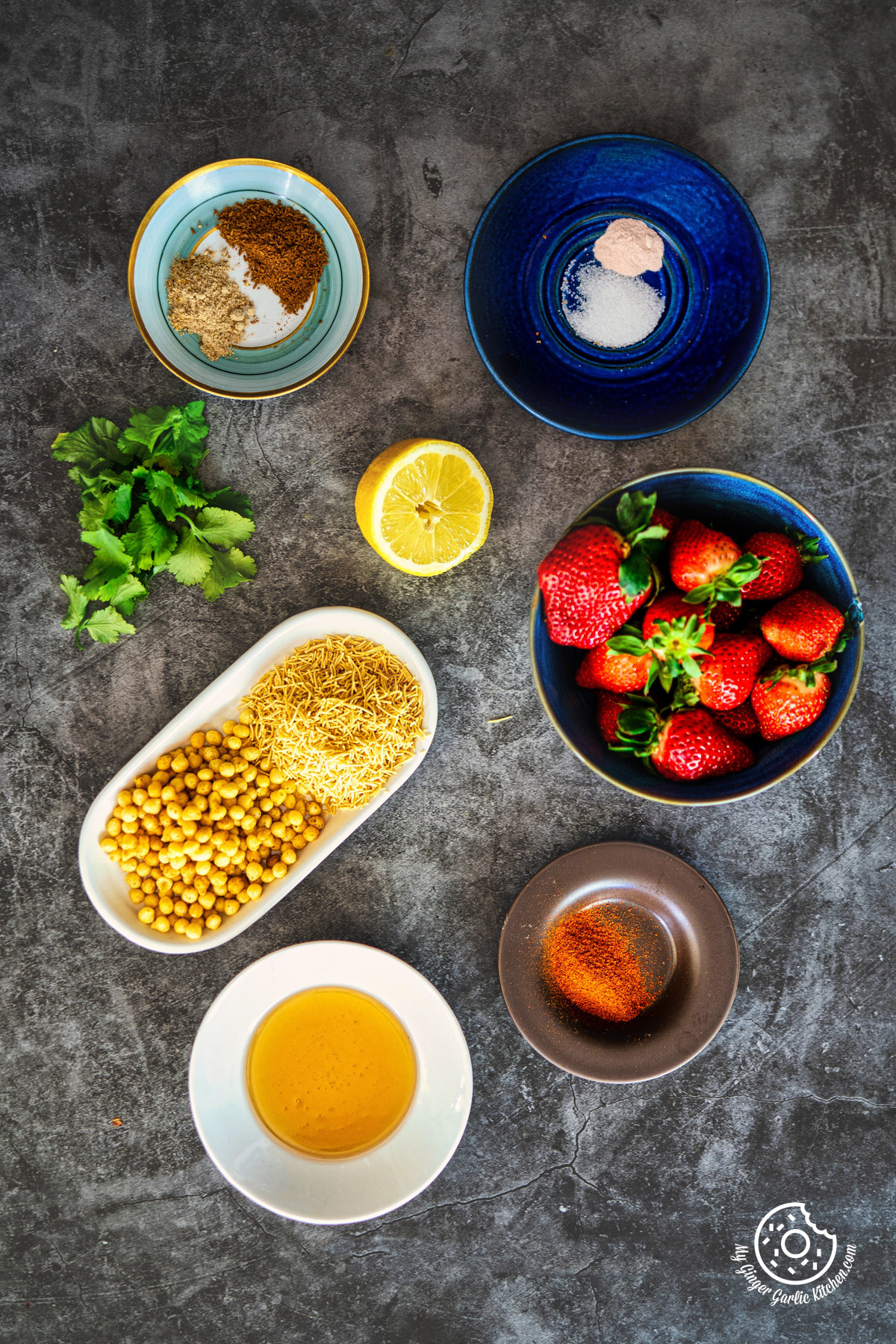 overhead photo of a table with strawberry chaat ingredients