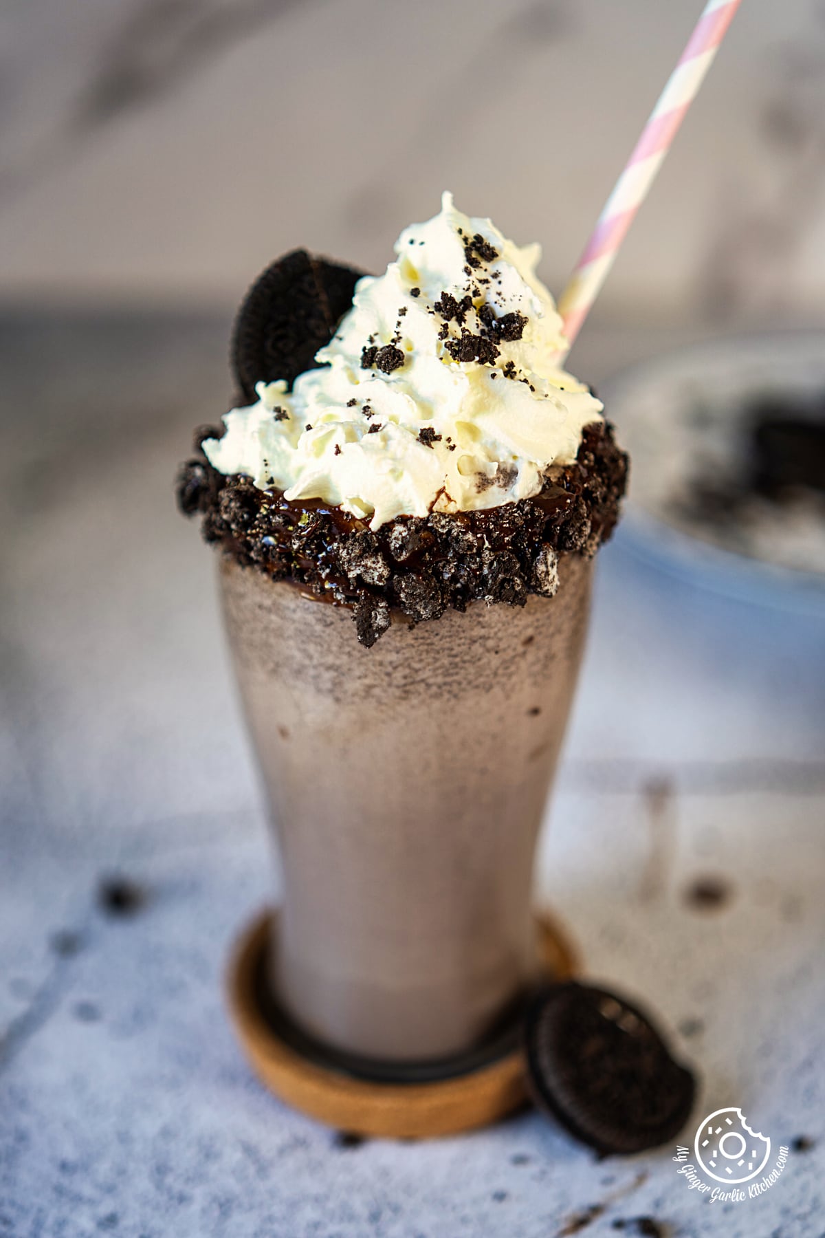 - photo of a Oreo milkshake with oreo cookies and whipped cream